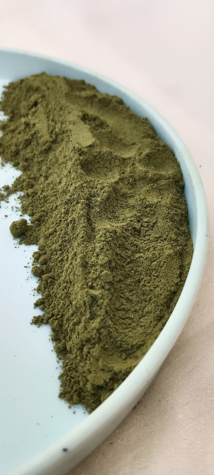 hibiscus leaf powder in a plate with white background