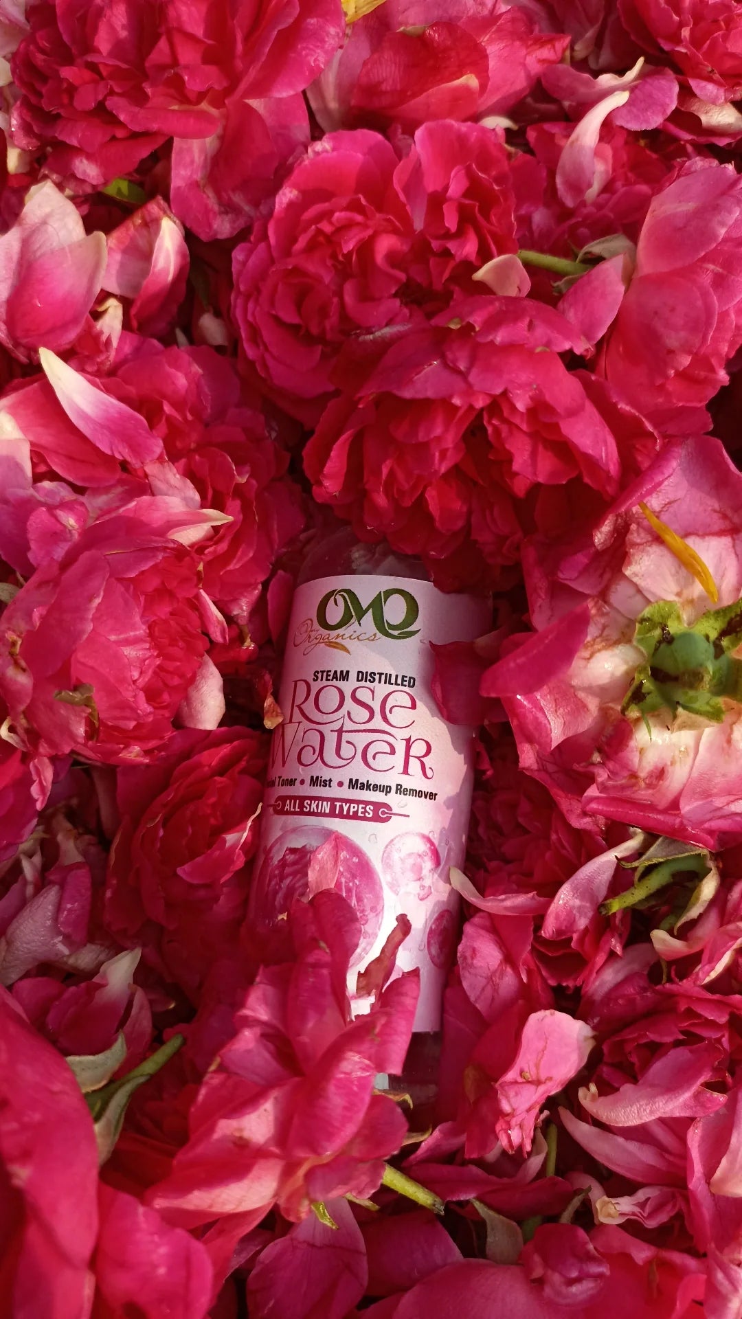 Rosewater with background of roses