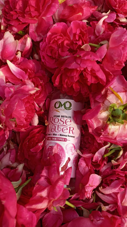 Rosewater with background of roses