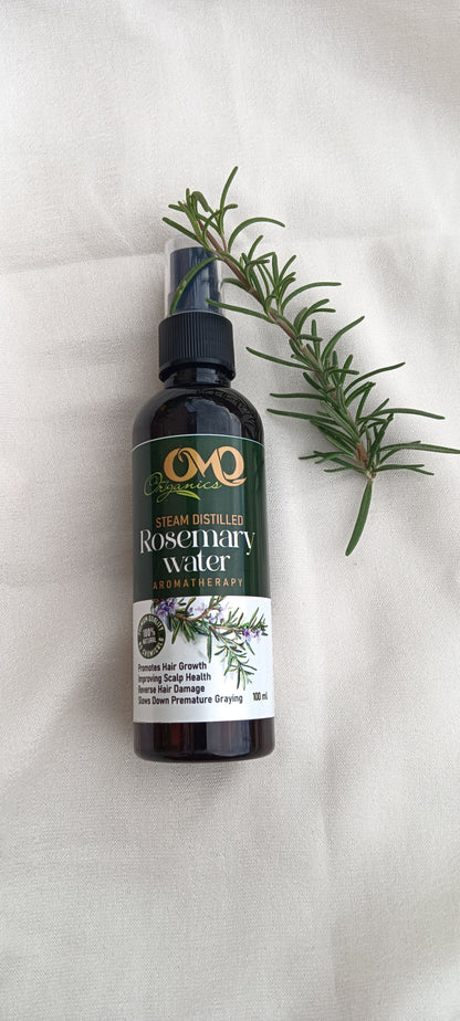 Steam Distilled Rosemary Water with white background and rosemary steam