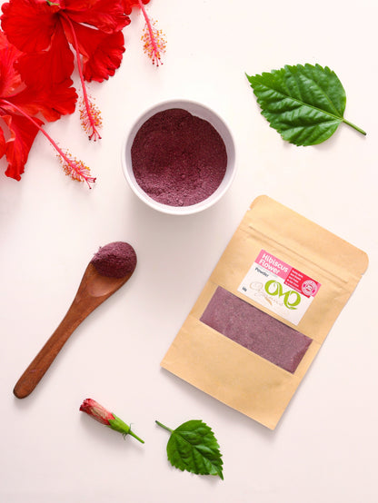 hibiscus flower powder with white background few flowers and leaves