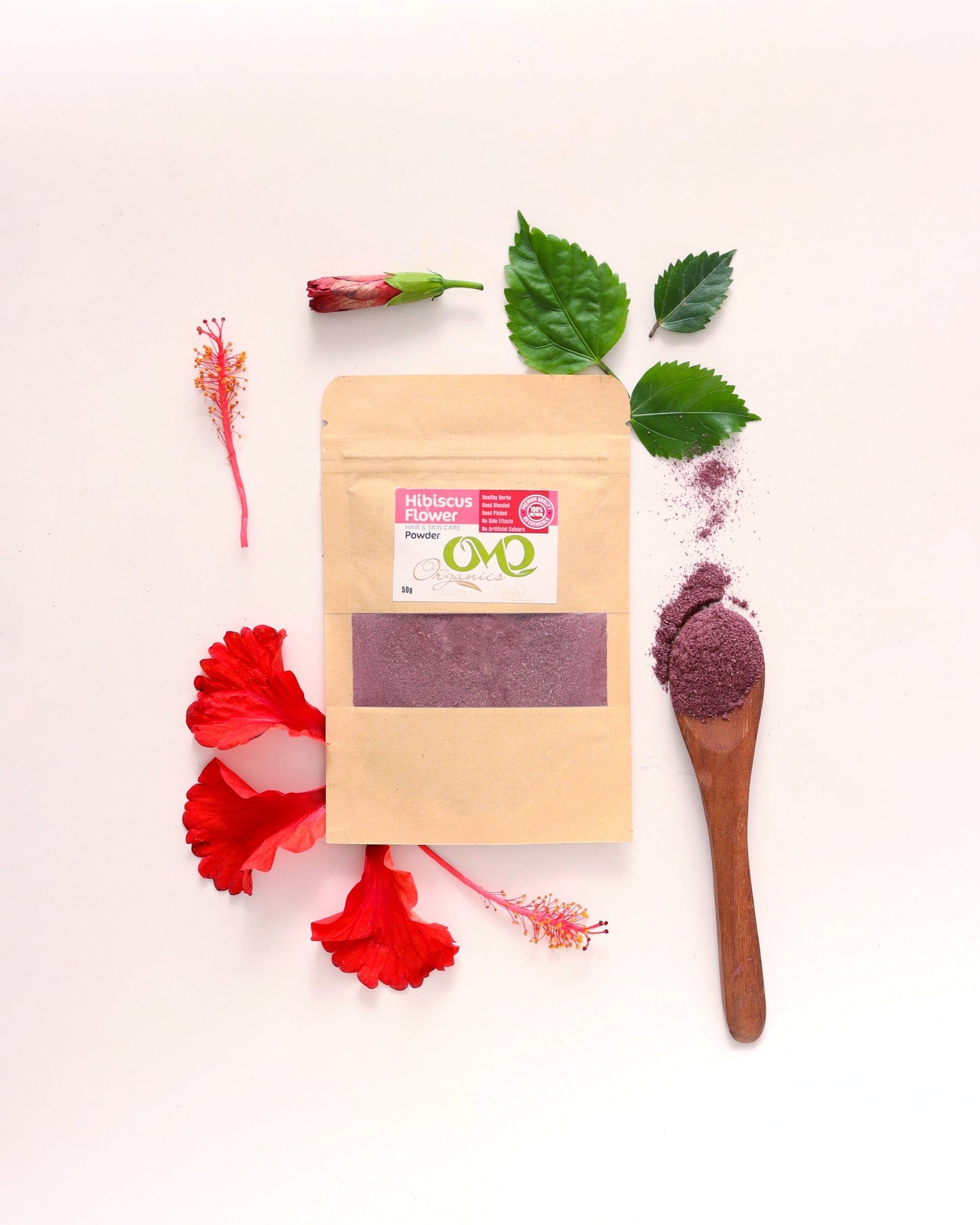 hibiscus flowers powder with white background and few leaves and flowers
