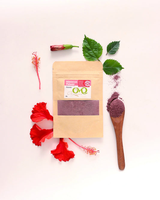 hibiscus flowers powder with white background and few leaves and flowers